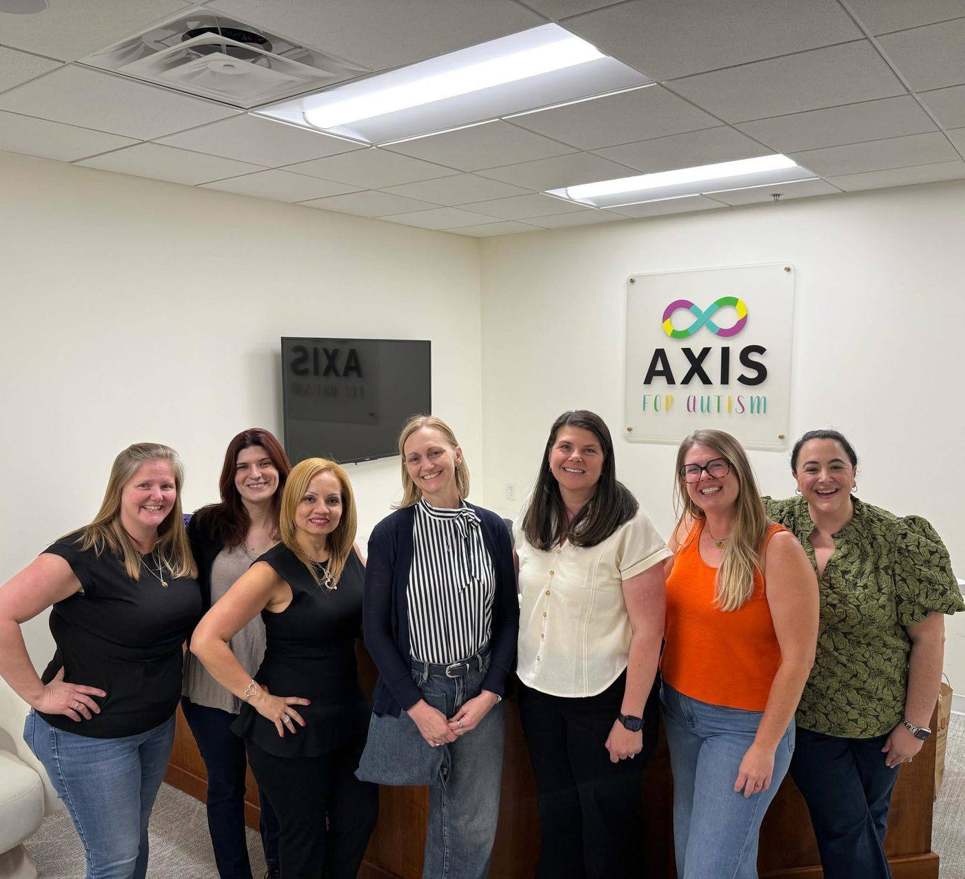 Axis for Autism team members and clinic moments with families and staff