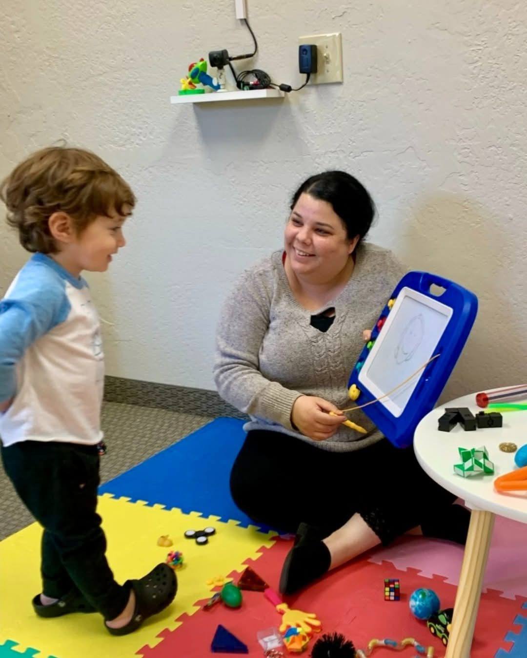 Axis for Autism team members and clinic moments with families and staff